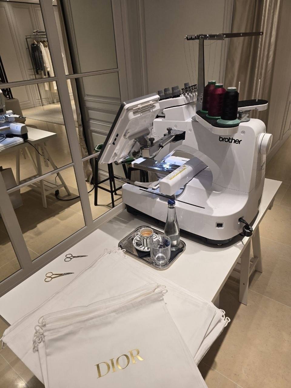 Embroidery machine personalising textiles live at a premium event